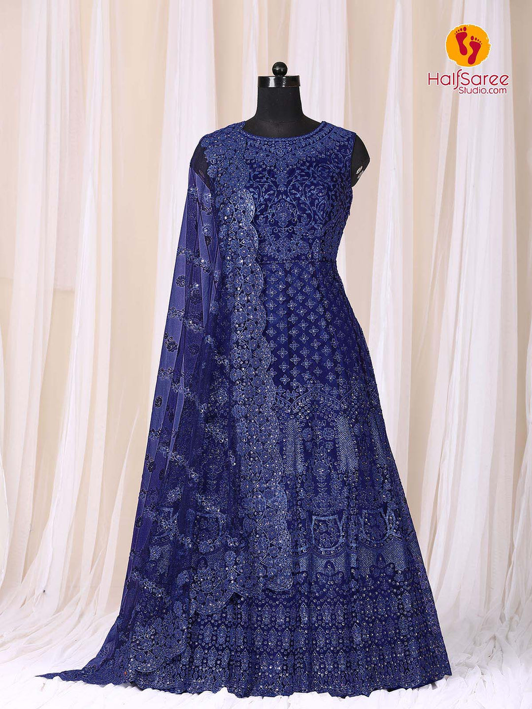 Dummy has dressed up with blue colour net gown with embroidered work